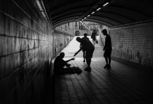 a group of people standing in a tunnel